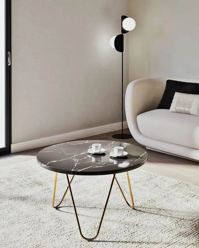 Table basse en marbre noir et métal doré Eagle D75 de Maisons du Monde