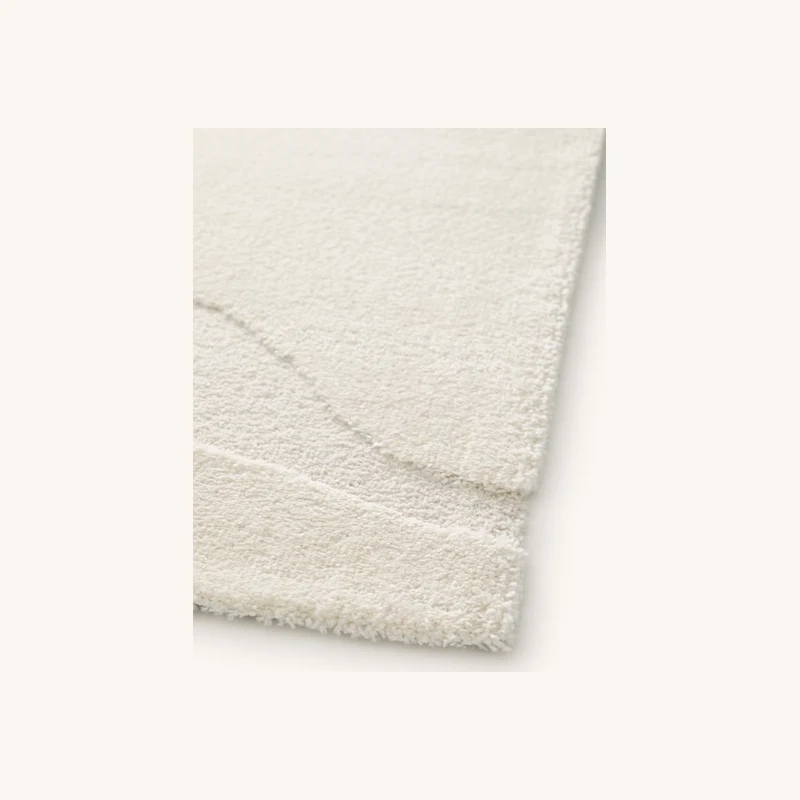 Tapis poils courts colas motif abstrait beige chez Bobochic