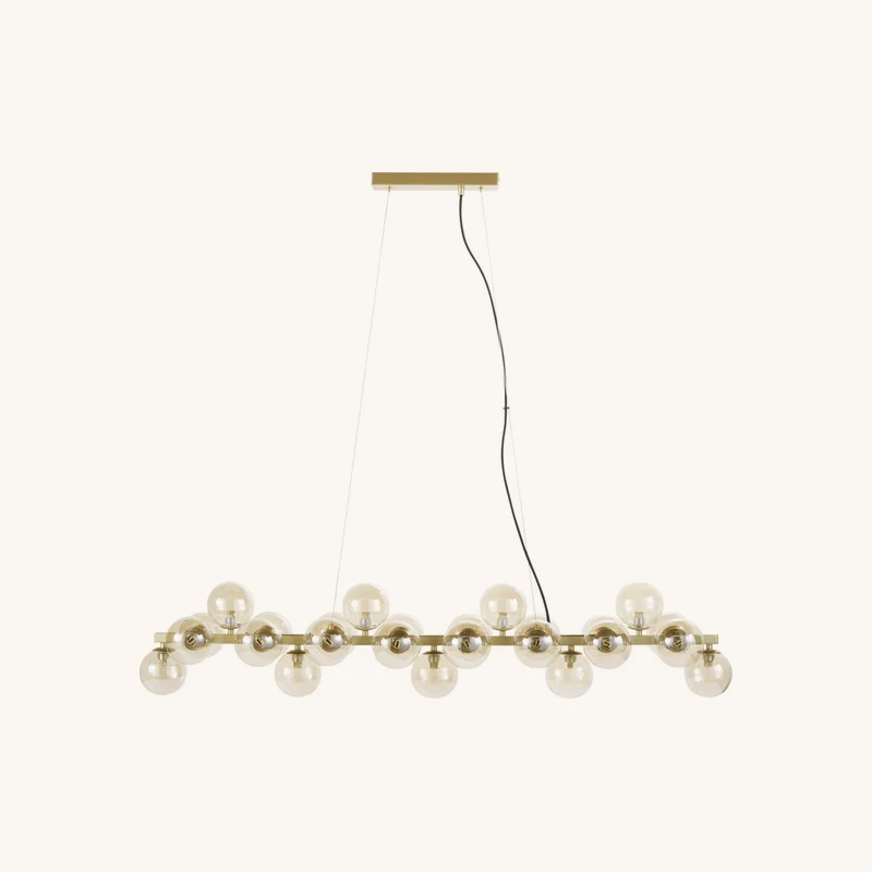Suspension en acier doré et globes en verre chez Maisons du Monde