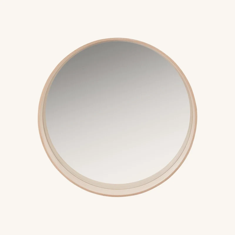 Miroir rond avec baguette asymétrique chez Maisons du Monde