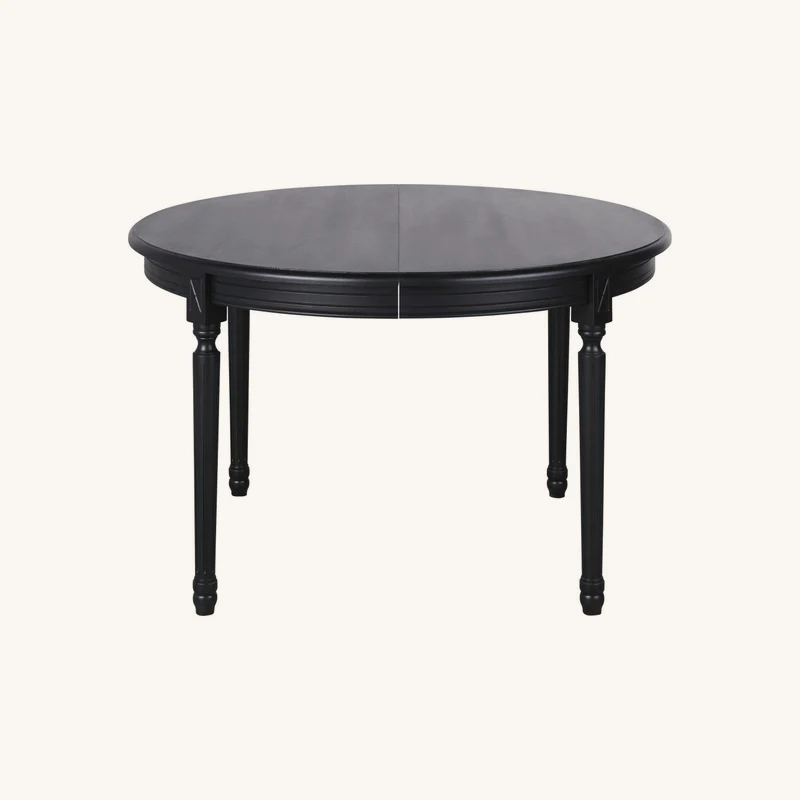 Table à manger ronde extensible noire 6/8 chez Maisons du Monde