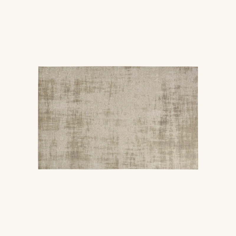 Tapis tissé jacquard écru et beige chez Maisons du Monde