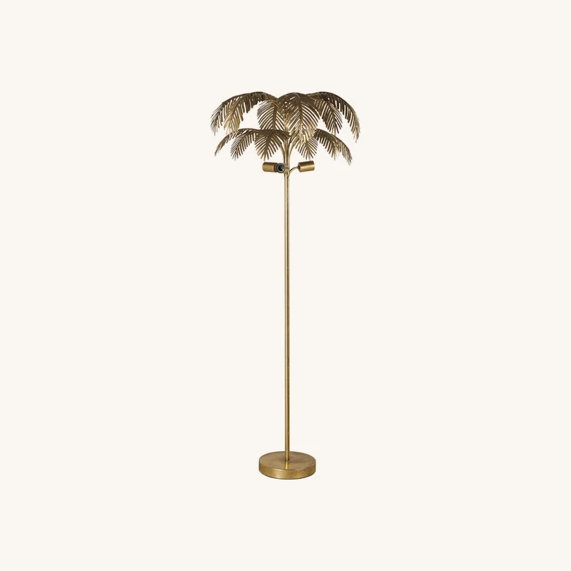 Lampadaire en zinc doré découpé chez Maisons du Monde