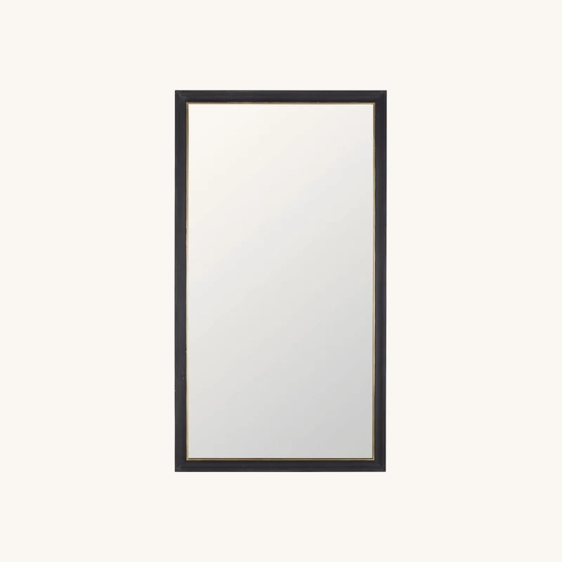 Grand miroir en bois de pin noir et doré chez Maisons du Monde