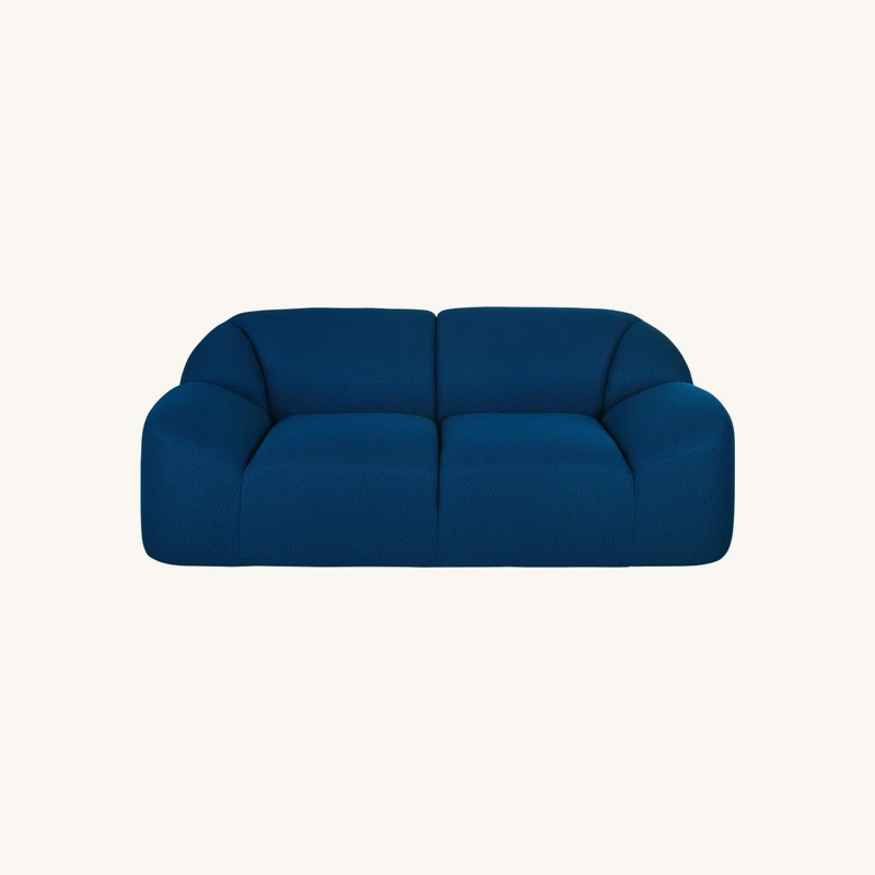Canapé 2 places en tissu mailles 3D coloris bleu chez Maisons du Monde