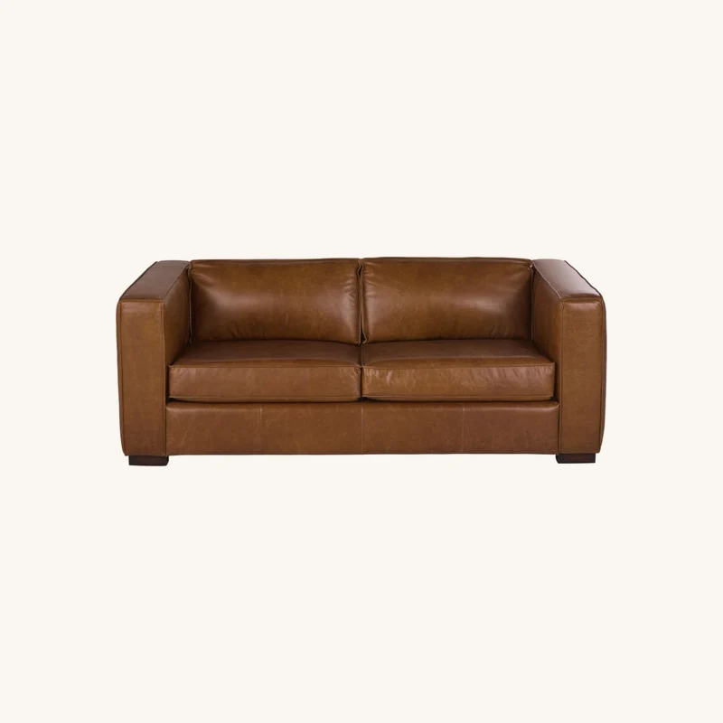 Canapé convertible 3 places en cuir de vachette chez Maisons du Monde