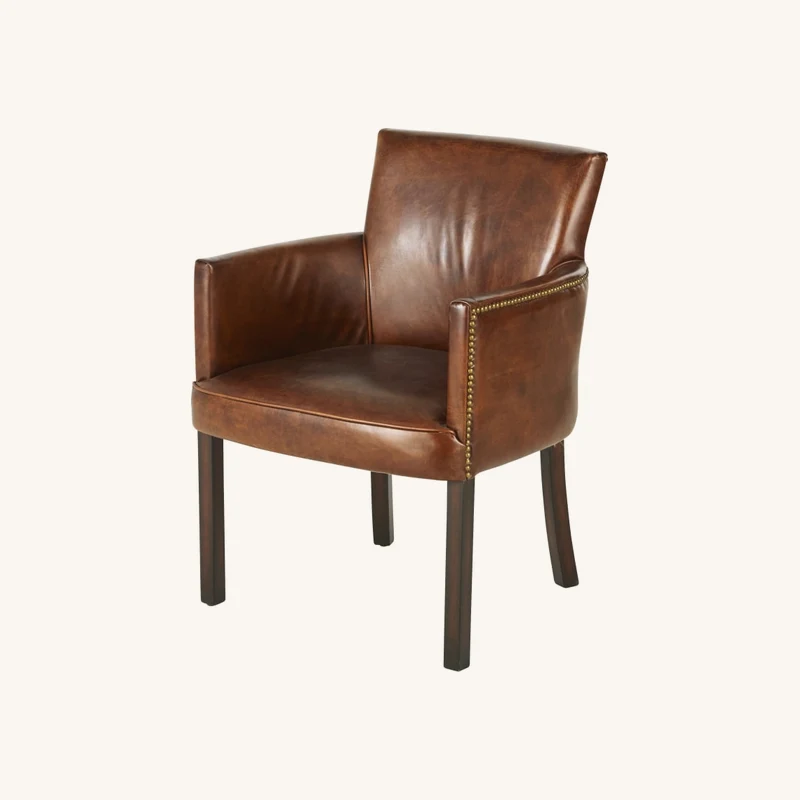 Chaise avec accoudoirs en cuir de vachette chez Maisons du Monde