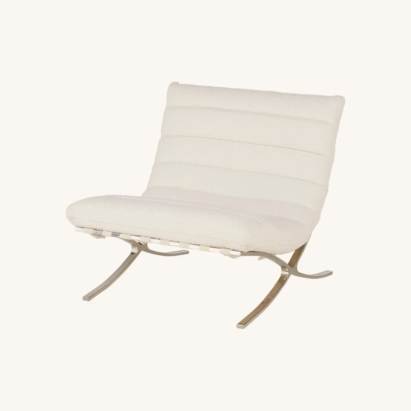 Fauteuil bouclettes écrues et acier chromé chez Maisons du Monde