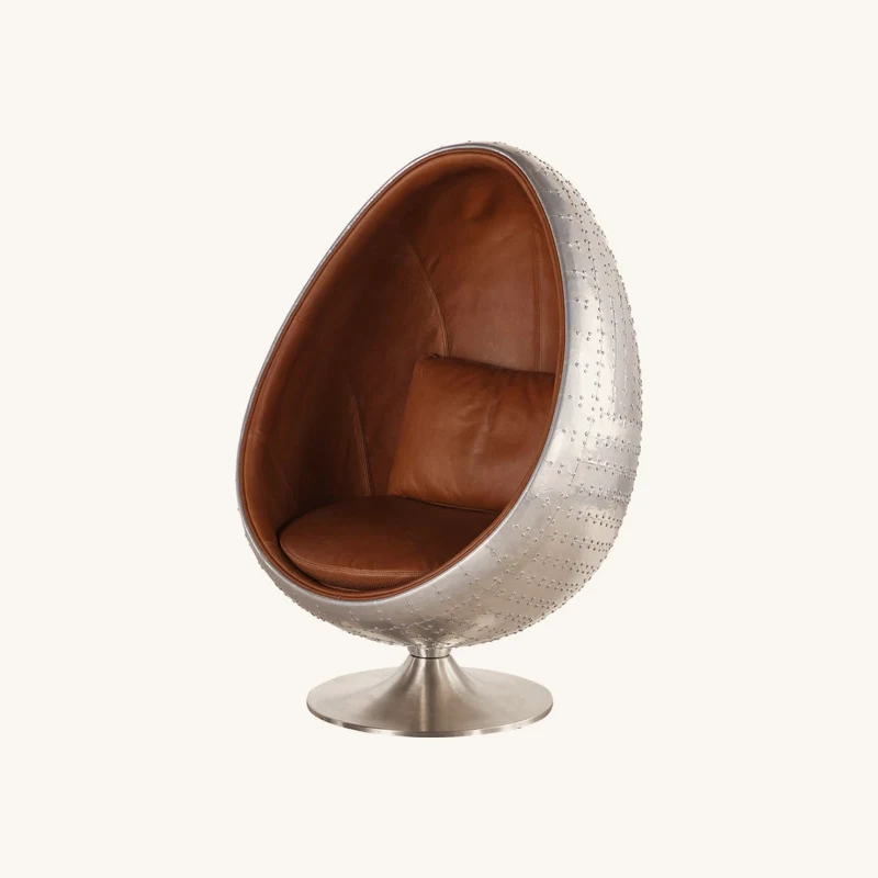 Fauteuil œuf industriel en cuir marron chez Maisons du Monde