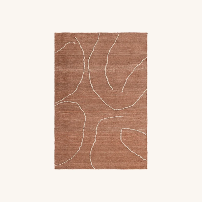 Tapis en jute terracotta chez The Cool Republic