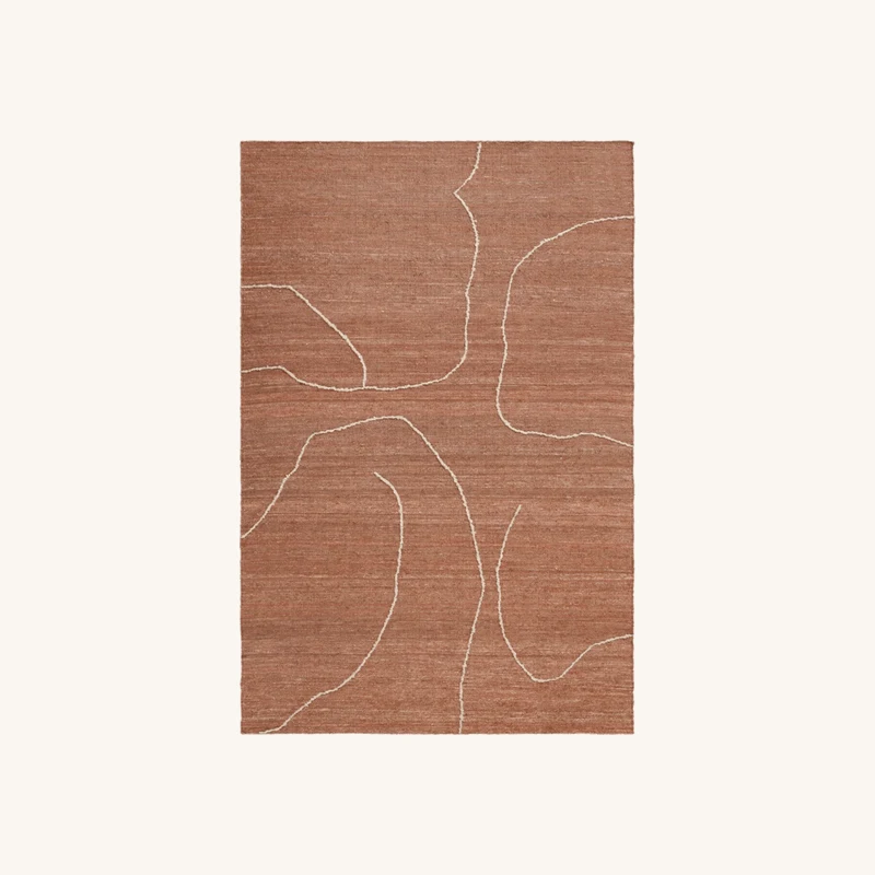 Tapis en jute terracotta chez The Cool Republic