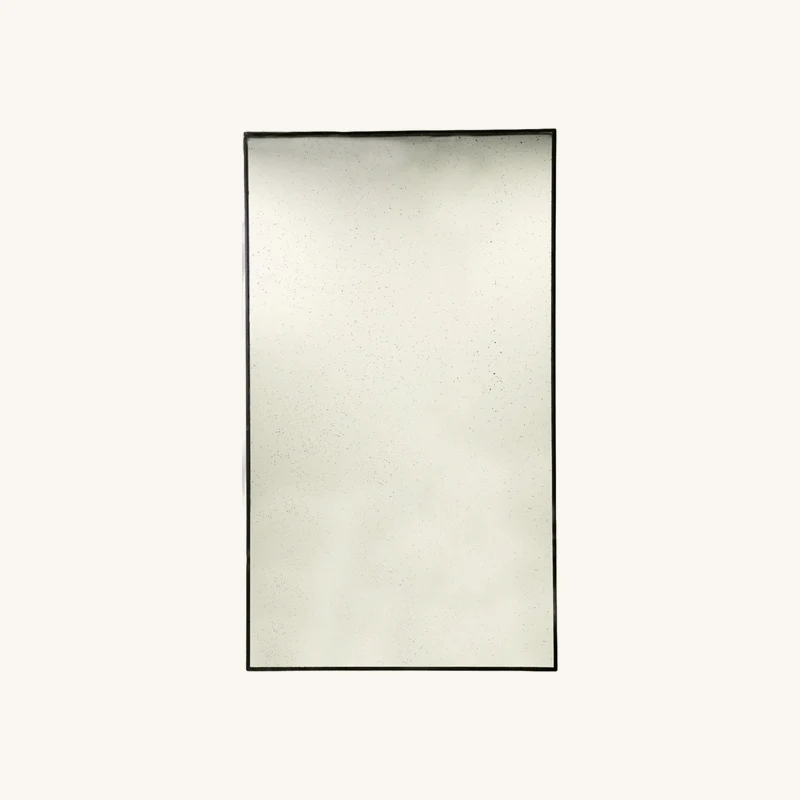 Miroir vieilli en bois noir chez The Cool Republic