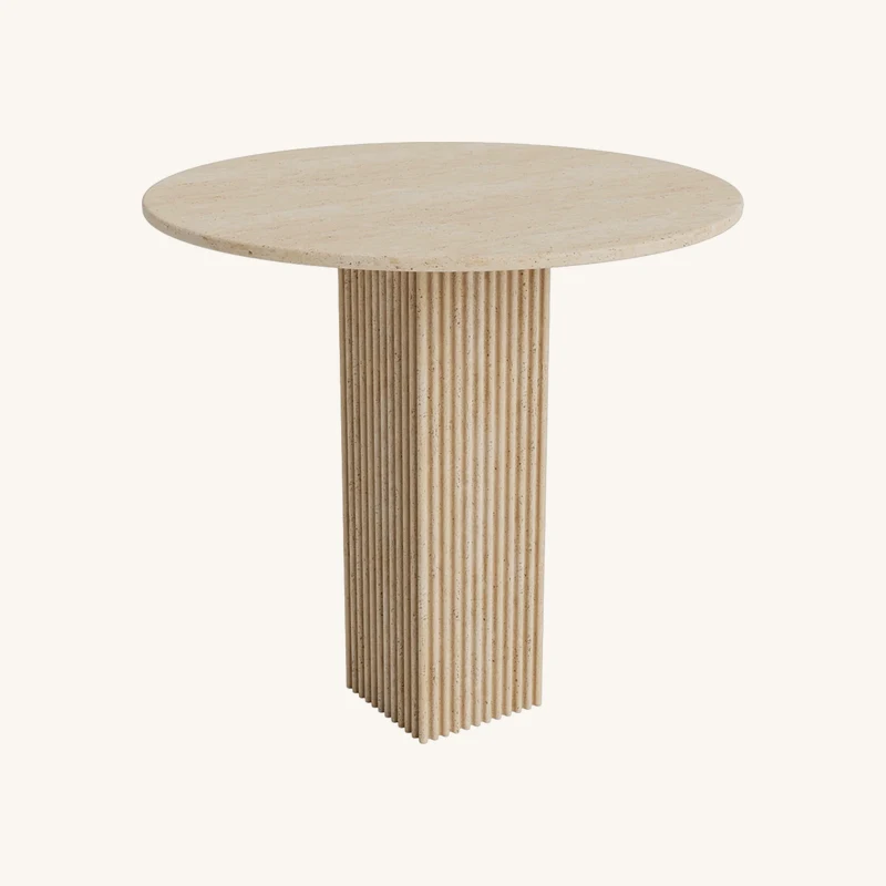 Table à manger ronde en travertin beige chez The Cool Republic