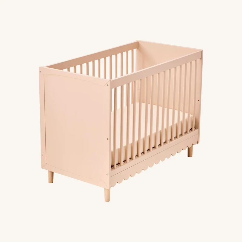 Lit bébé évolutif ligne feston rose chez Vertbaudet